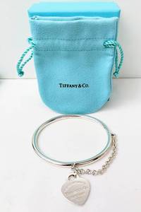 lot 139 image: Tiffany & Co. Sterling Heart Tag Bangle with Chain - Sterling Silver Return to... Charm, with Box and Pouch
