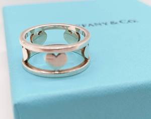 lot 140 image: Tiffany & Co. Sterling Silver Cut-Out Hearts Band Ring Size 7, with Box