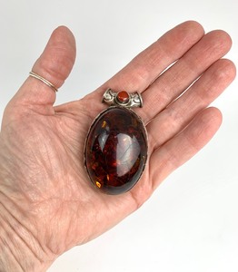 lot 95 image: Large Baltic Amber Cabochon Pendant Set in Sterling Silver
