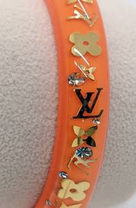 lot 144 image: Louis Vuitton Tangerine Inclusion Bracelet with Dust Pouch, Box