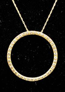 lot 83 image: Circle Pendant Necklace of 10K Yellow Gold, New with Tags