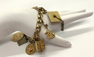 lot 122 image: Vintage Iconic 1961 Charm Bracelet w 10 charms (14K, Sterling, 120 12K)