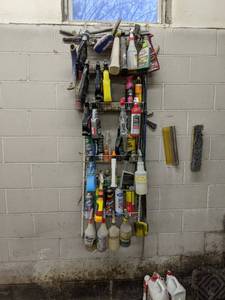 lot 131 image: Hanging rack full of car care produ...