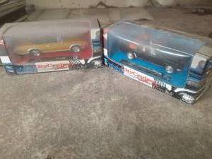 lot 68 image: 143 scale die cast 1964 Mustang an...