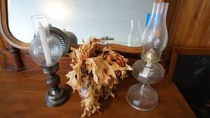lot 26 image: Glass Kerosene Lamp W Clear Glass Chimney--A Brass Tall Stick Candle Holder W Clear Glass Chimney--Ceramic Vase W Dried Leaves In It