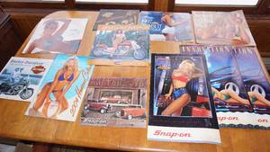 lot 31 image: Nine Collectible Calendars---Harley Davidson Motorcycles--Hooters Calendars--Snap On Tools Calendars
