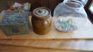 lot 42 image: Clear Glass Fish Bowl W Colored Stones & Sea Shells In It---Brown Ceramic Cookie Jar W Lid---Wicker Basket W Cover & Metal Handle