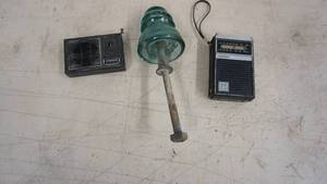 lot 153 image: Real Tone AMFM Solid State Hand Held Radio--10 Transister Item--Green Glass Insulator