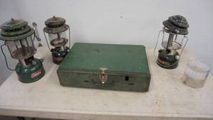 lot 148 image: Three Coleman Lanterns--A Coleman Two Burner Camp Stove-(425F)
