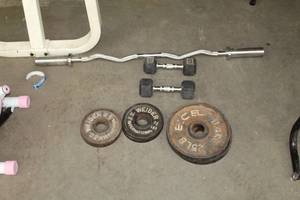 lot 518 image: Curling Bar, 25# Weights (x2), 10# Weights (x2), 5-12# Weights (x4), 10# Dumbbells (x2)