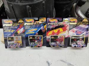 lot 604 image: Lot of (4) Hot Wheels Pro Racing 1st Edition Superspeedway 1997 NASCAR Stock Car 164 Scale Die-Cast Metal Replica Adult Collectible (In Original Packaging)