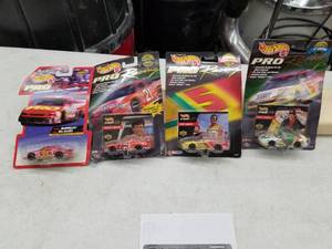 lot 606 image: Lot of (4) Hot Wheels Pro Racing 1997,1998 NASCAR Stock Car 164 Scale Die-Cast Metal Replica Adult Collectible (In Original Packaging)