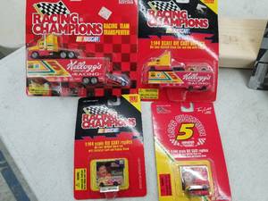 lot 618 image: Lot of (4) Racing Champions Racing Team Transport and Race Car 1144 Scale Die-Cast Metal Replica Adult Collectible (In Original Packaging)