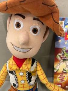 lot 83 image: Toy Story Talking Plush Toy with Book