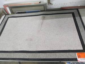 47 inch x 30 inch rubber mat with a ...