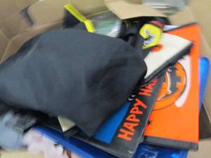 box of halloween costumes, bags and...