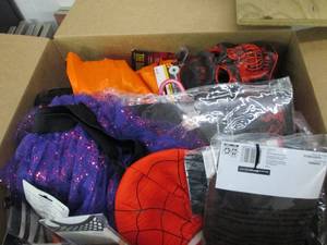 box of halloween masks, suits and m...