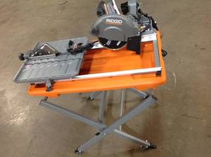 RIDGID 9 Amp Corded 7 in. Wet Tile Saw with Stand in good conditon see pictures