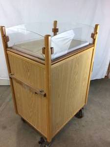 lot 14 image: Wooden Pediatric Infant Cot Bed with 3 Drawers Locking Cabinet On Wheels With Drop Down Side Clear Panels - Great For Veterinarians Too - I would love to paint this a different color & use for a fancy portable changing table