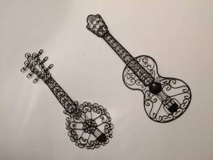 2 string instrument wall hangings 1...