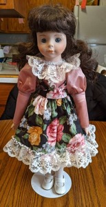 17 Porcelain Doll on stand (see ph...