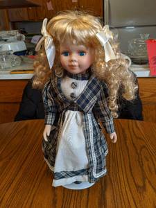 16 Porcelain Doll on stand (see ph...