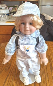 16 Porcelain Doll on stand (see ph...