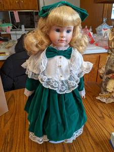 19 Porcelain Doll on stand (see ph...