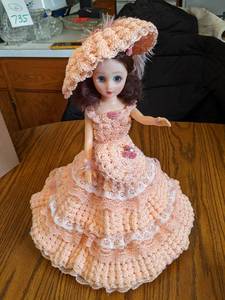15 plastic doll on stand with love...