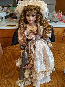 20 Porcelain Doll on stand (see ph...