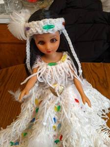 15 plastic doll with intricate han...