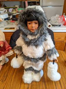 20 Alaskan Porcelain Doll on stand...