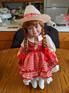 18 Porcelain Cowgirl Doll on stand...