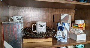 shelf of contents including Avon Hu...
