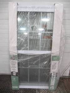 lot 137 image: American Craftsman 28 in. x 54 in. 70 Series Single Hung Fin Vinyl Window - White With Screen and Internal Grill.