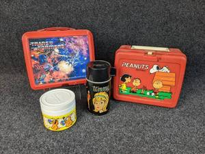 Vintage Lunch Lot - Transformers Lunchbox with matching Thermos (1984), Peanuts Lunchbox (1980s), Tammy Thermos, and Garfield Insulated Jar (1980s)