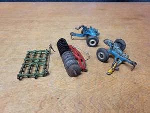 lot 21 image: Vintage Arcade Cast Iron Tractor Attachments - Sickle Mower (Arcade), 1 Bottom Plow (Arcade), Disc (Marked 704) and Drag (No Mark)