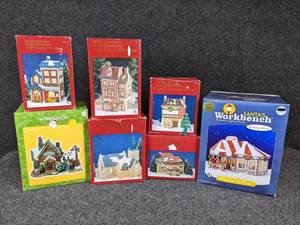 lot 175 image: Lot of 7 Dickens Collectables and Santas Workbench Christmas Village Buildings