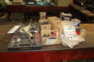 lot 106 image: Tire Repair Supplies  with Patches, Valve Stems, Torque Nuts