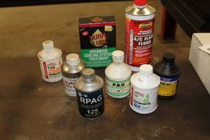lot 248 image: Lot of (8) Automotive AC Chemicals  - R-134A Refrigerant, Tech Select R134a Hybrid Electric, RPAG HFC-R134a Compressor Oil, PAG 134a Refrigerant Oil, AC Flash Flush, Advanced Cooling System Treatment