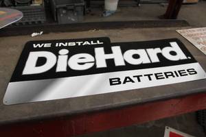lot 191 image: Metal We Install Diehard Batteries Sign