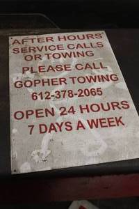 lot 192 image: Metal Gopher Towing Sign