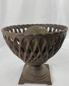 lot 7 image: Intriguing Cast Iron Planter and Wrought Iron Basket