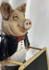 lot 19 image: Chef Butler Pig Statue Holding Chalkboard by Telle M. Stein