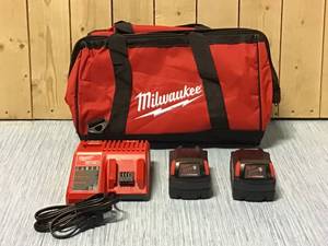 Milwaukee M18 18-Volt Lithium-Ion XC Starter Kit with (2) 5.0Ah Batteries, Charger &amp Contractor Bag Customer Returns See Pictures