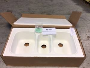 lot 81 image: Swan Drop-InUndermount Solid Surface 44 in. 1-Hole 402040 Triple Bowl Kitchen Sink in White Customer Returns See Pictures