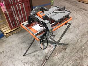 lot 101 image: 9 Amp Corded 7 in. Wet Tile Saw with Stand by RIDGID Customer Returns See Pictures