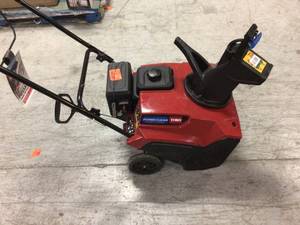 lot 104 image: Power Clear 721 E 21 in. 212 cc Single-Stage Self Propelled Electric Start Gas Snow Blower by Toro Customer Returns See Pictures