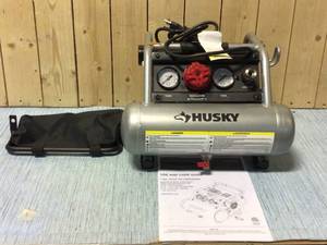 lot 35 image: Husky 1 Gal. Portable Electric-Powered Silent Air Compressor Customer Returns See Pictures