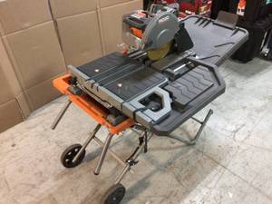 lot 106 image: 10 in. Wet Tile Saw with Stand by RIDGID Customer Returns See Pictures